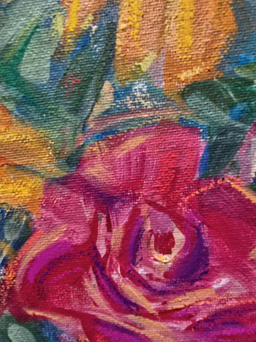 Close-up of a colorful painted floral scene with a prominent pink and magenta rose in the foreground and green, yellow, blue, and orange brushstrokes in the background.