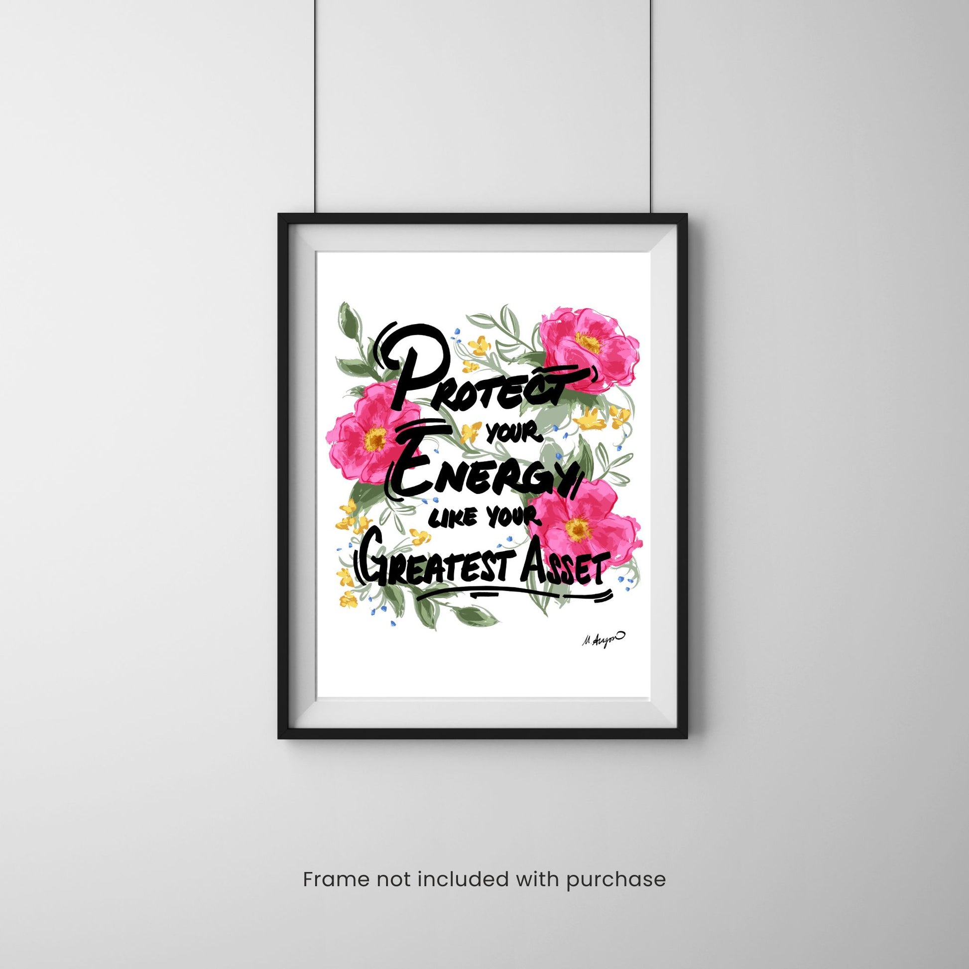 Framed print with floral design and motivational quote on a gray wall.