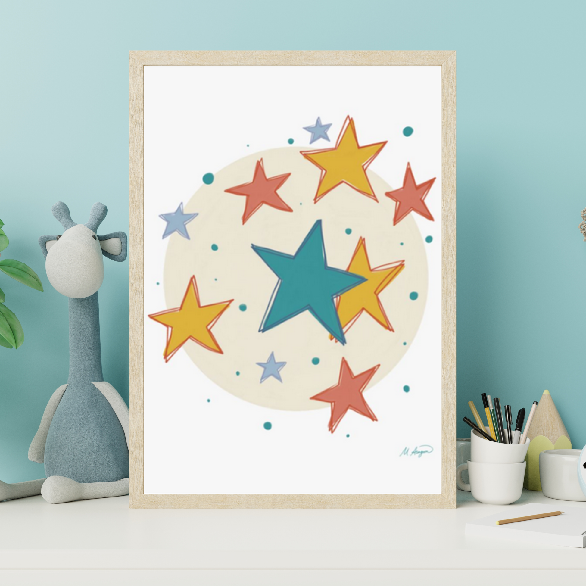 Framed artwork with colorful stars on a white background, displayed on a shelf against a light blue wall.